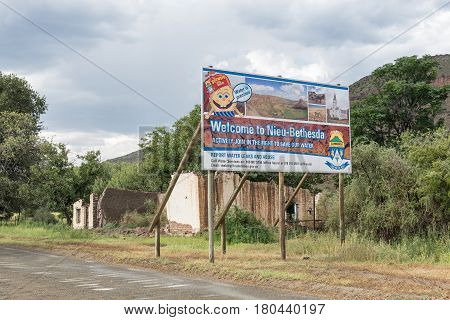 NIEU BETHESDA SOUTH AFRICA - MARCH 21 2017: A welcome sign and ruin at the entrance to Nieu-Bethesda an historic village in the Eastern Cape Province