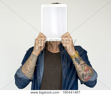 Man standing and holding digital device