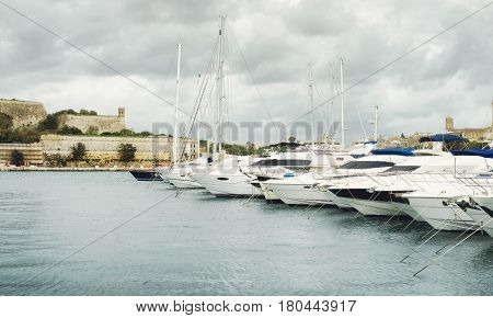 View of Valletta`s Fort St Elmo and yachts moored at Msida Marina Malta
