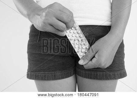 Woman with combined pills in hands,Woman healthcare concept and ideas