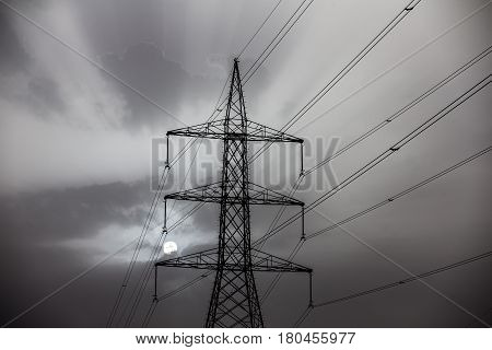 sunrise behind power lines in a desert near Abu Dhabi