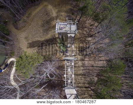 Aerial picture of people doing wall climbing and zipline in North Georgia