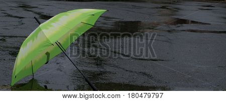 Umbrella blown into street in the rain