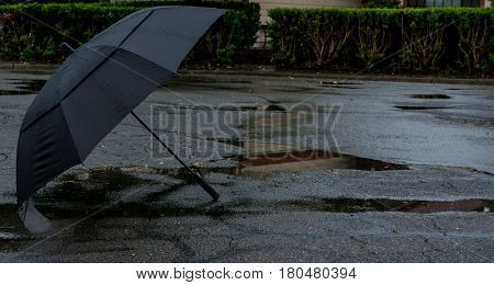 Umbrella in the street in a storm