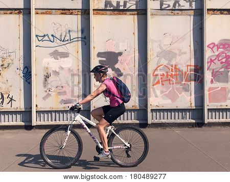 Kiev, Ukraine - April 04, 2017: Pedestrian goes Graffiti wall background. Urban street