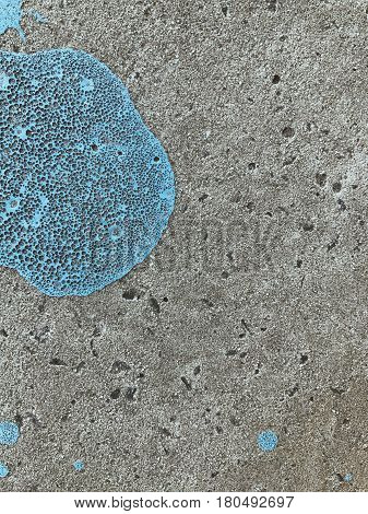 Bkue painted stain on concrete gray background