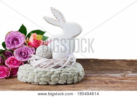 Easter eggs hunt - Bunny with nest of white eggs and roses border isolated on white background