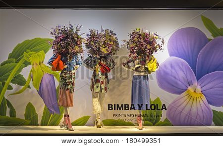 PARIS FRANCE - MARCH 27 2017: Mannequins in the showcase of the Printemps department store in Paris France. Spring and summer theme.