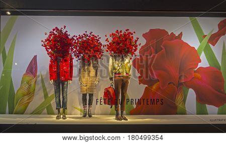 PARIS FRANCE - MARCH 27 2017: Mannequins in the showcase of the Printemps department store in Paris France. Spring and summer theme.