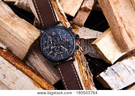 Wrist Watch Men's Brown Leather Strap On Wood.