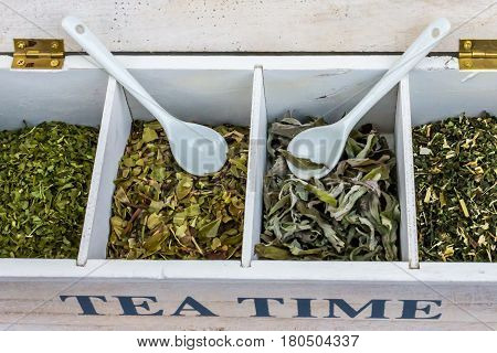 `TEA TIME` box with dried herbs and two white porcelain tea spoon