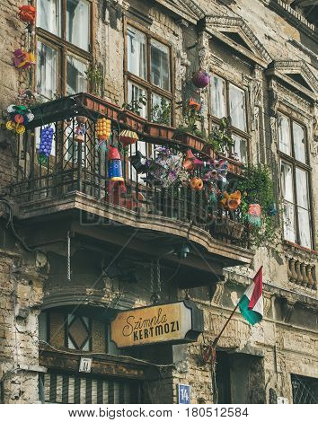 BUDAPEST, HUNGARY - MARCH 26, 2017: Kazinczy Street and facade of the most popular ruin pub of Budapest Szimpla Kert with balcony