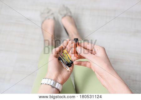 Different perfume samples in female hands