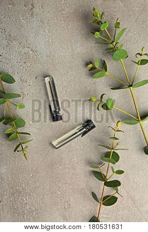 Beautiful composition with perfume samples on light background