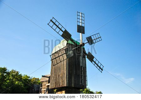 Traditional Ukrainian historical windmill at museum of Ukrainian national architecture in Pirogovo village Kiev Ukraine.