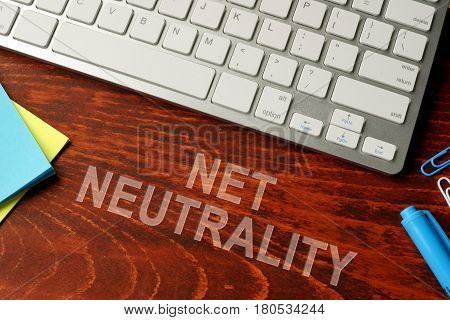 Net neutrality written on a wooden surface. Neutral internet concept.