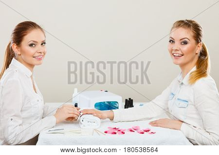 Beautician With Client At Beauty Salon.