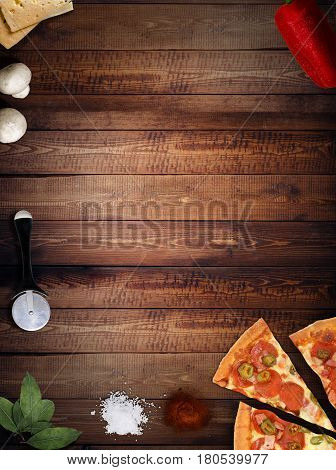 fresh pizza with mushrooms salami pepper on dark beackground top view