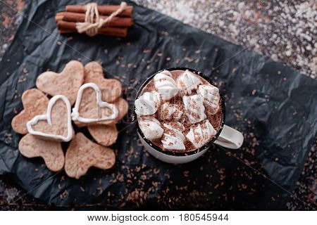 cocoa with marshmallows and cookies cinnamon sticks
