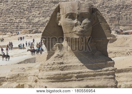Closeup View Of The Sphinx Head With Pyramid In Giza Near Cairo, Egypt