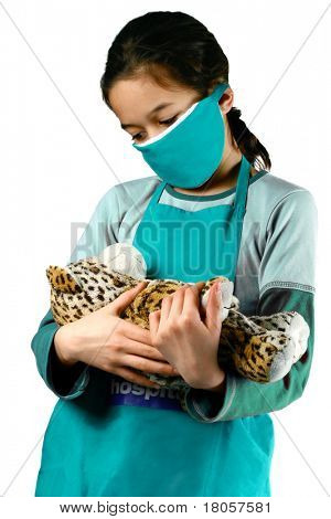 Una giovane ragazza che finge di essere un medico/infermiere, giocare a vestirsi, isolated on white.
