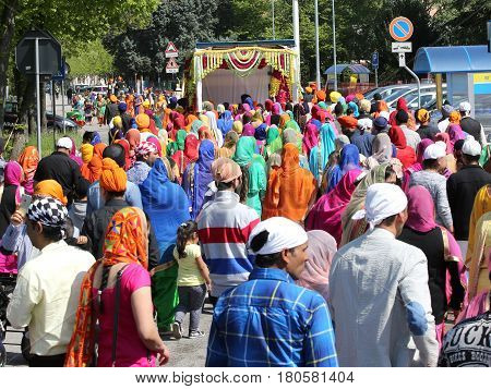 Vicenza, Vi, Italy - April 8, 2017: People Sikh Procession Pray During A Religious Nagar Kirtan Fest
