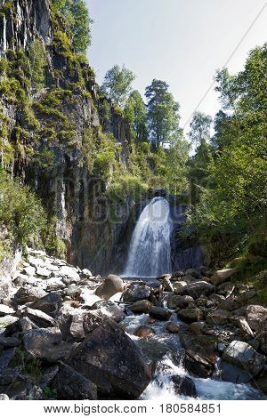 Russia Siberia. Korbu waterfall in the Altai in summer