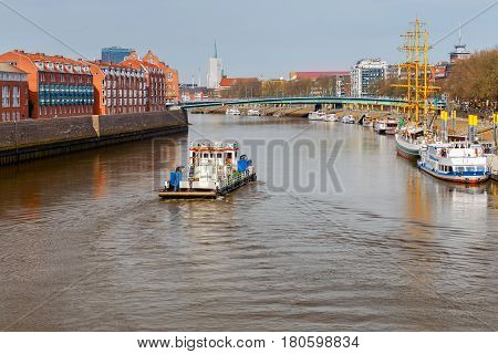 The river tugboat along the river Weser in the city of Bremen.