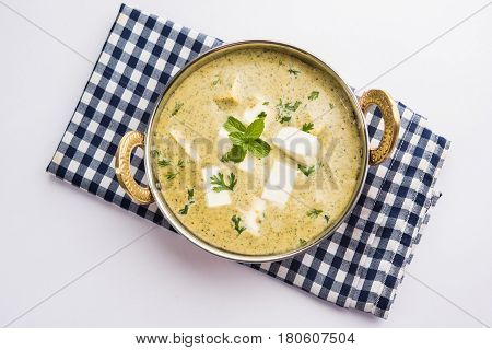 methi malai paneer or Creamy Fenugreek & Paneer Curry, popular north indian recipe prepared using milk cream, methi and paneer or cottage cheese, served with roti/paratha, selective focus