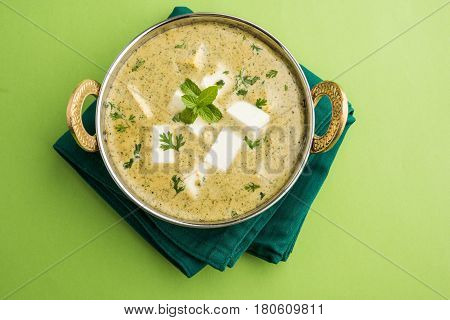 methi malai paneer or Creamy Fenugreek & Paneer Curry, popular north indian recipe prepared using milk cream, methi and paneer or cottage cheese, served with roti/paratha, selective focus