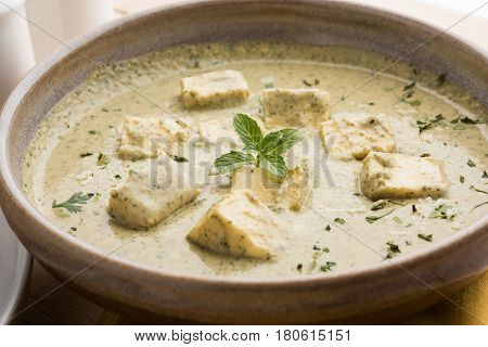 methi malai paneer or Creamy Fenugreek & Paneer Curry, popular north indian recipe prepared using milk cream, methi and paneer or cottage cheese, served with roti/paratha, selective focus