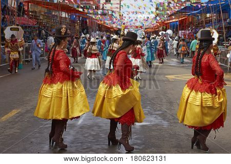 ORURO, BOLIVIA - FEBRUARY 26, 2017: Morenada dance group in colourful outfits parading through the mining city of Oruro on the Altiplano of Bolivia during the annual Oruro Carnival.