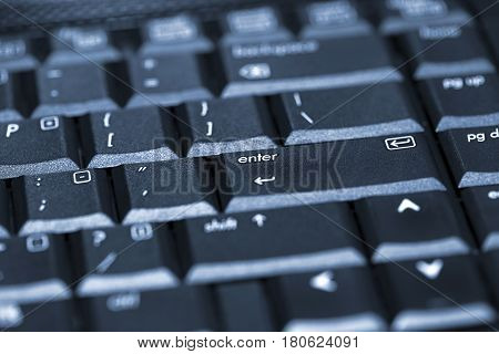 Black laptop keyboard close up as background