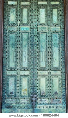 Door of the Basilica di San Giovanni in Laterano (Papal Archbasilica of St. John Lateran) in Rome, Italy. Background.