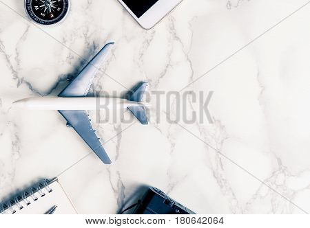 Air Travel acccessories on luxury marble with copy space