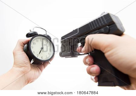 Kill time Gun shooting clock with male hand.