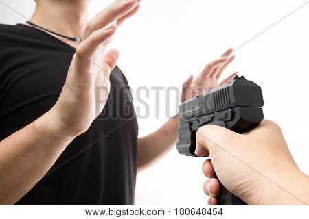 Robber With A Gun Robbing Intimidate A Man Surrender. Isolated White Background. Bandit Steals From