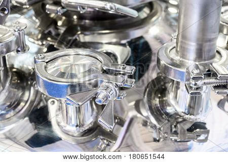 A large-scale fragment of a pharmaceutical autoclave. Abstract industrial background.