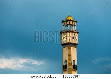 Batumi, Adjara, Georgia. Close Up Of Chacha Tower On Blue Evening Sky Background. Local Landmark. Tower Is Surrounded By 4 Fountain Pools With Chacha. Chacha Is A Grape Brandy Or Grappa.