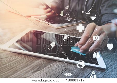 Medical Co Working Conceptdoctor Working With Smart Phone And Digital Tablet And Laptop Computer To 