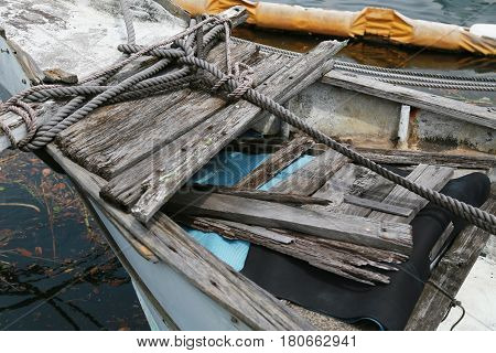 A sight of an old wooden ship anchored at the harbor
