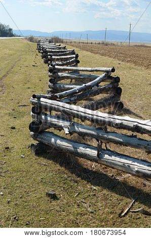 Traditional Zigzag Fence Protecting A Pasture In Buryatia. Tunkinskaya Valley