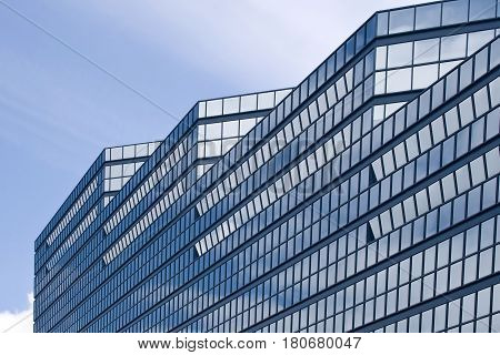 Exterior of contemporary glass business center in smart city