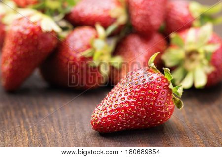 Fresh strawberries closeup on a wooden table