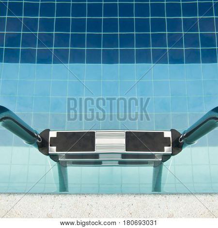 Swimming pool at modern hotel with sunshine