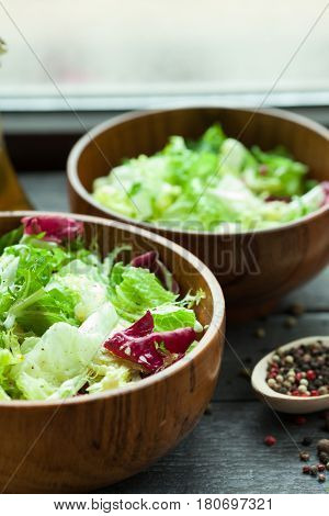 A Dish Of Fresh Salad Frisse, Romano And Radiccio With Olive Oil, Salt And Freshly Ground Percec In