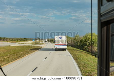 KENNEDY SPACE CENTER FLORIDA USA - FEBRUARY 18 2017: Transport buses transporting visitors to NASA rocket launch FALCON 9