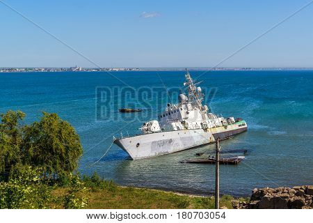 Damaged Ukrainian military boat lies near the sea coast in Feodosiya, Crimea. Abandoned warship shot in the summer of 2016.