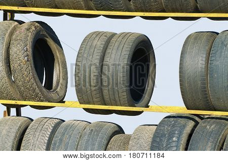 Worn-out tyres from vehicles or discarded as waste in the trash.