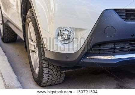 Closeup photograph of anti-fog headlights of moderm new car.